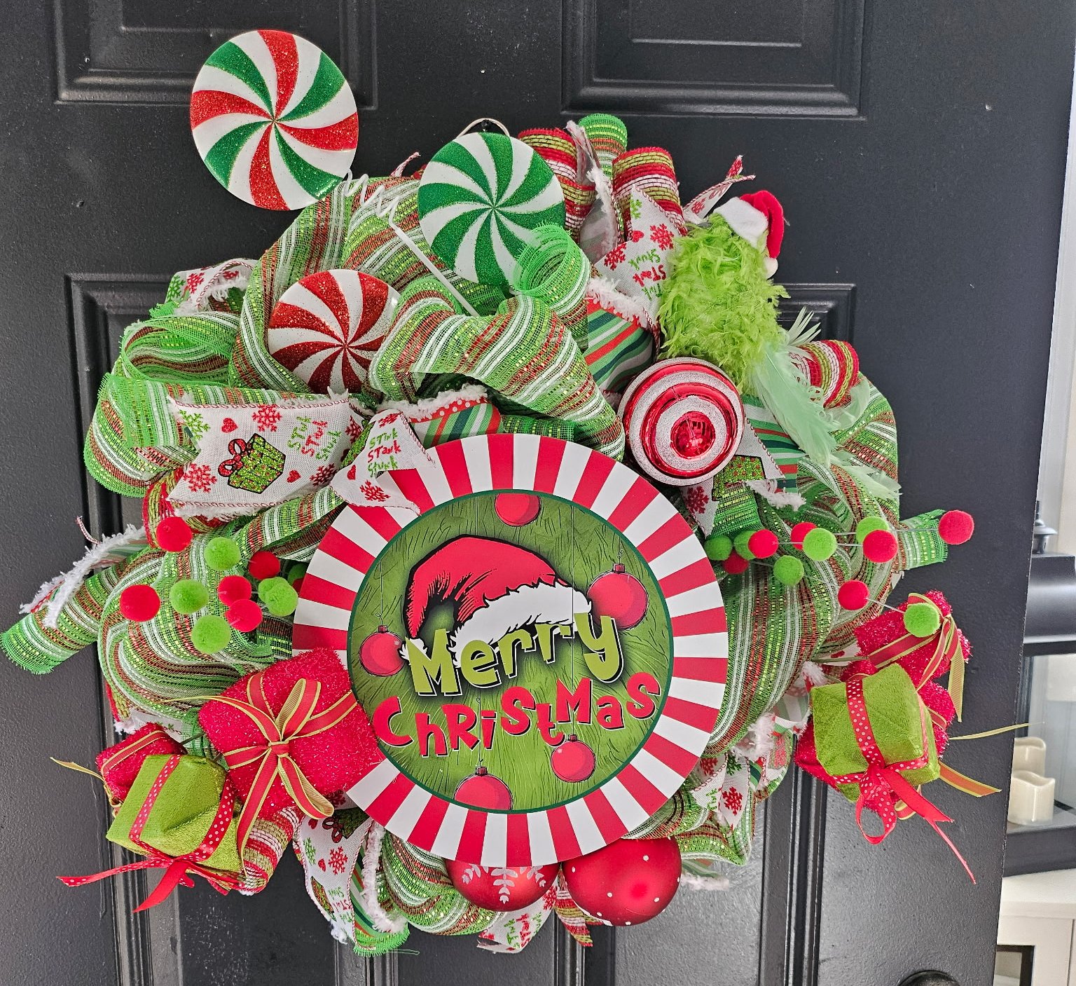 Merry Christmas Peppermint Wreath with Candy Decorations and Red & Green Ribbon